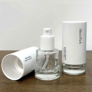 refillable glass concealer bottle with white cap